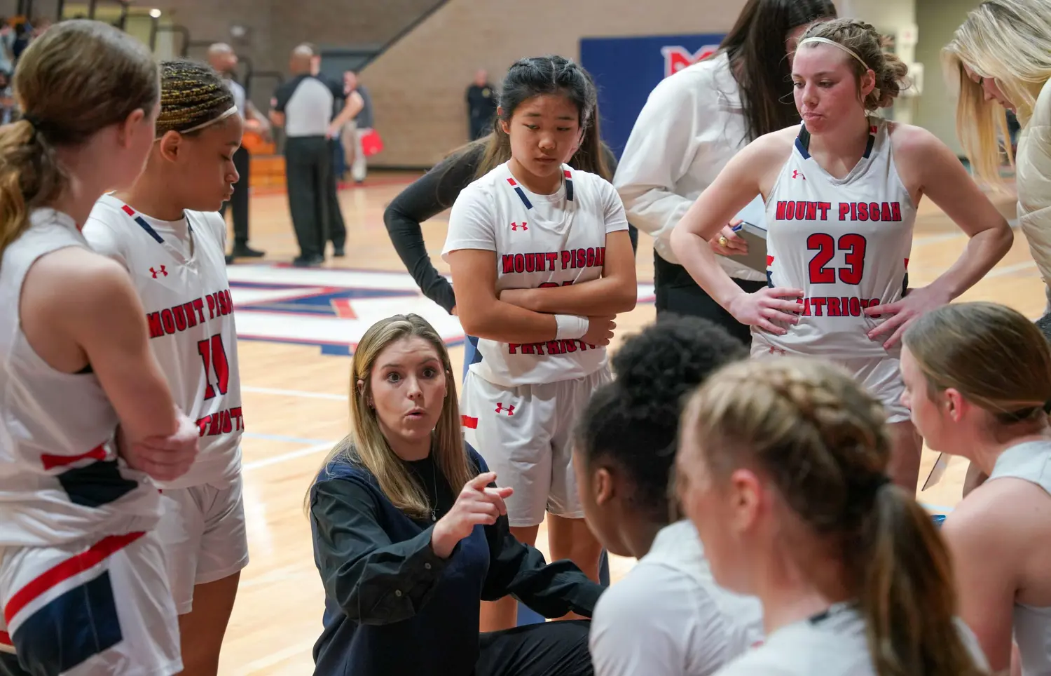 Coach instructing team